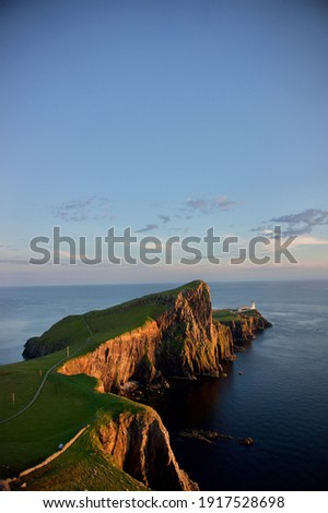Neist Point Lighthouse at sunset, Isle of Skye, Scotland.	 Royalty-Free Stock Photo #1917528698