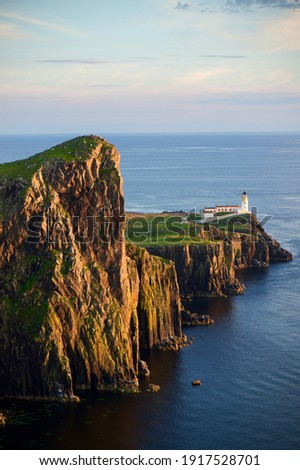 Neist Point Lighthouse at sunset, Isle of Skye, Scotland.	 Royalty-Free Stock Photo #1917528701