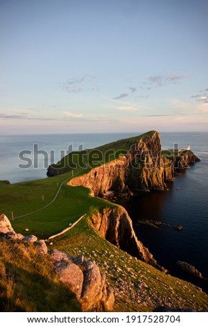 Neist Point Lighthouse at sunset, Isle of Skye, Scotland.	 Royalty-Free Stock Photo #1917528704