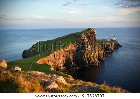 Neist Point Lighthouse at sunset, Isle of Skye, Scotland.	 Royalty-Free Stock Photo #1917528707
