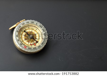 compass on  blackboard background