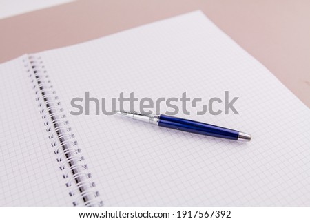 a beautiful pen on a4 notebook for study or work
