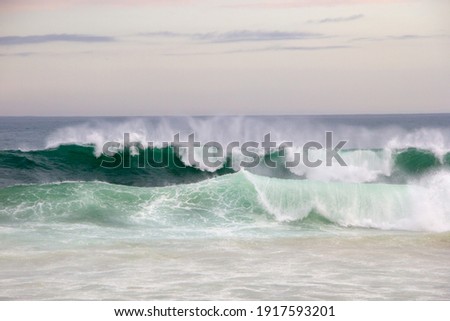 lonely crashing waves in the late afternoon at leblon beach in Rio de Janeiro Brazil.