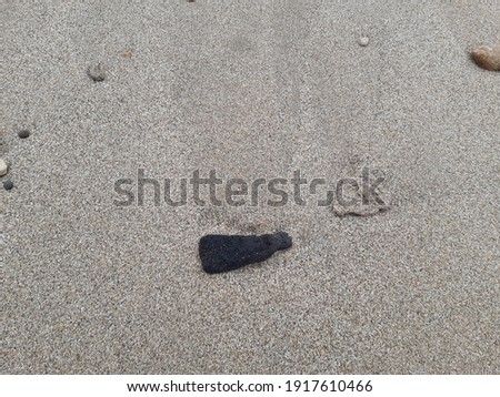 Black and white gravel in the beach