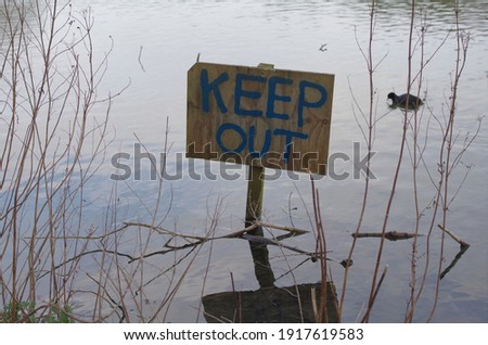 Soft selective focused photo of sign post in water