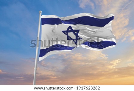 Large Israel flag waving in the wind Royalty-Free Stock Photo #1917623282