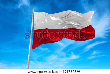 Large poland flag waving in the wind Royalty-Free Stock Photo #1917623291