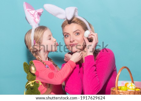 Daughter kiss her mother for Easter, isolated