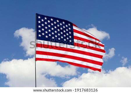America flag isolated on the blue sky with clipping path. close up waving flag of America. flag symbols of America.