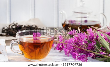 Herbal tea made from fireweed known as blooming sally in teapot and cup