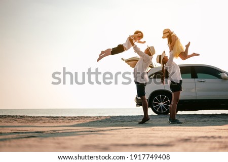 Family vacation holiday,Happy family, parents holding children flying in the sky.Concept family and Holiday and travel. Royalty-Free Stock Photo #1917749408
