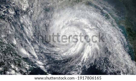 Super Typhoon, tropical storm, cyclone, hurricane, tornado, over ocean. Weather background. Typhoon,  storm, windstorm, superstorm, gale moves to the ground.  Elements of this image furnished by NASA. Royalty-Free Stock Photo #1917806165