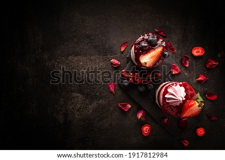 Flat lay of mini round strawberry cheesecake with space for your text