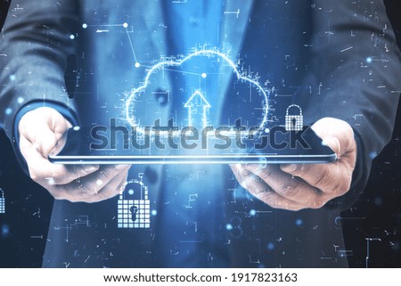 Cloud service technologies with digital cloud sign with arrow up above digital tablet in businessman hands. Double exposure