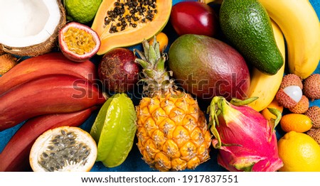 Fresh tropical fruits flat lay. Different exotic fruits on blue summer tropical background. Fresh fruits background. Travel and holiday. Healthy food, diet, vegan, vegetarian concept. Top view
 Royalty-Free Stock Photo #1917837551
