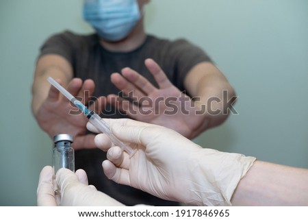 the patient does not agree to put the vaccine, vaccination. anti-vaccination Royalty-Free Stock Photo #1917846965