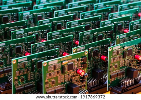 Batch of Produced Automotive Printed Circuit Boards with Surface Mounted Components Royalty-Free Stock Photo #1917869372