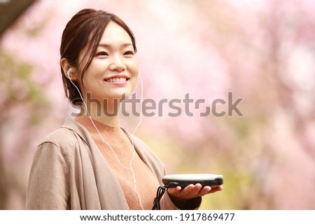 Woman listening to music on a CD player 