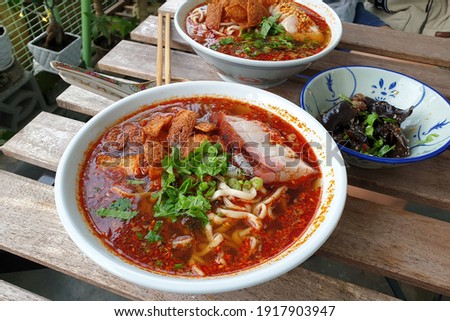 Sichuan mala spicy soup noodle with chicken meat and crispy pork. Chinese food.