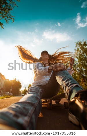 girl on a skateboard, on the street