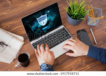 Man using firewall protection for secure connection to internet Royalty-Free Stock Photo #1917958715