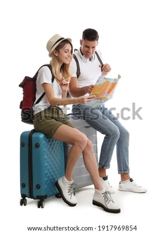 Couple with map and suitcases on white background. Summer travel Royalty-Free Stock Photo #1917969854