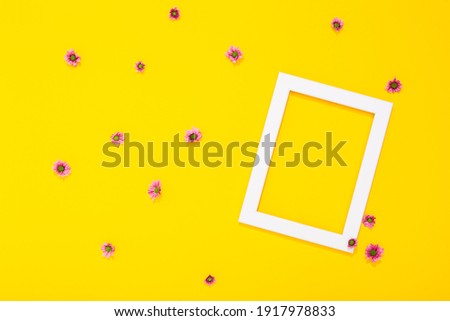 Banner with flower and blank white photo frame on yellow background with copy space, free text place. Framing workshop. Bright festive certificate. Border picture. Summer remembrance. Greeting card.