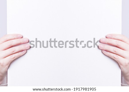 white sheet held in hands