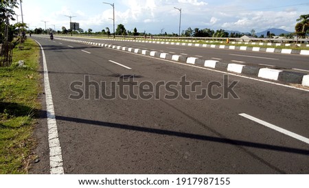 Road in the city of Mataram on a sunny day