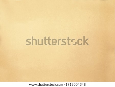 A paper background of a yellowish color with a rough surface aged by time.Texture or background Royalty-Free Stock Photo #1918004348