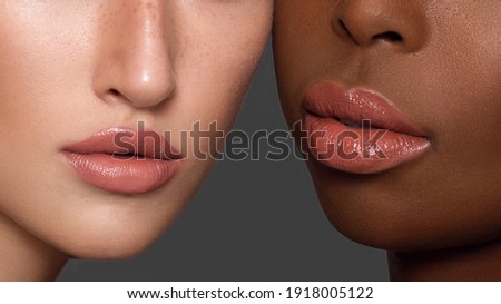 Women portrait mix races black skin and white skin female beauty. closeup  two cheerful multiethnic woman. Beautiful girl, flawless skin. Diverse friends. blond lips makeup  Royalty-Free Stock Photo #1918005122