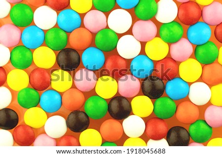 Rainbow bright candies. Cheerful colorful childrens yummy background