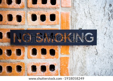 Design metal sheet no smoking sign on brick wall, sign and simbol, none smoking area