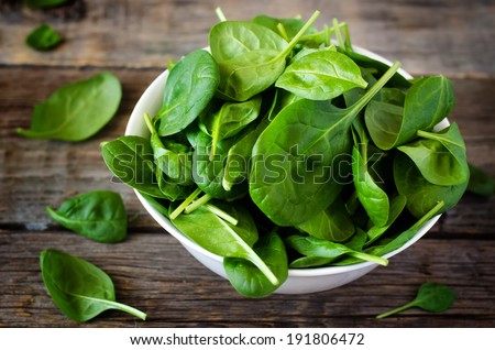 spinach in the bowl on the dark wood background. toning. Royalty-Free Stock Photo #191806472