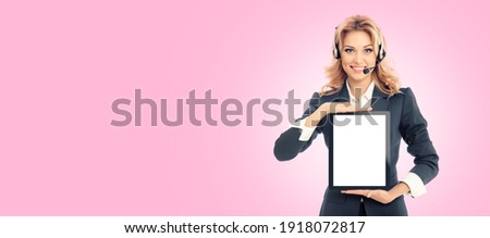 Call center. Businesswoman or female support phone operator in headset, show blank tablet pc copy space for slogan ad text, over pink color background. Customer service help consulting. iPad touchpad 