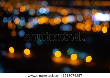 Blurred city lights at night to be used as background image