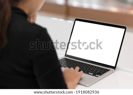 Young women working on her laptop with blank copy space screen for your advertising text message in office, Back view of business women hands busy using laptop at office desk. Royalty-Free Stock Photo #1918082936