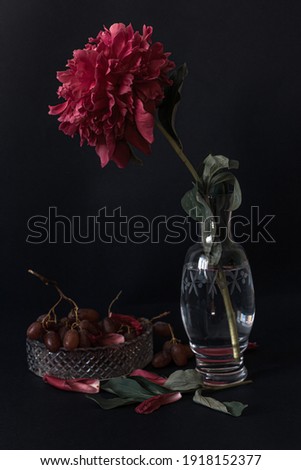 
Still life with peony and grapes.