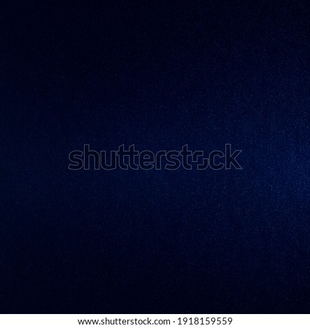 Dark blue artificial leather surface and dark blue background