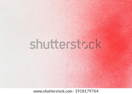 spray paint red on a white paper background  Royalty-Free Stock Photo #1918179764