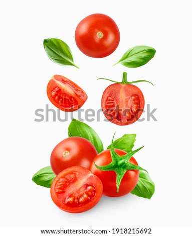 Cherry tomatoes with basil leaves  isolated on white Royalty-Free Stock Photo #1918215692