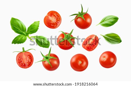 Cherry tomatoes with basil leaves  isolated on white Royalty-Free Stock Photo #1918216064