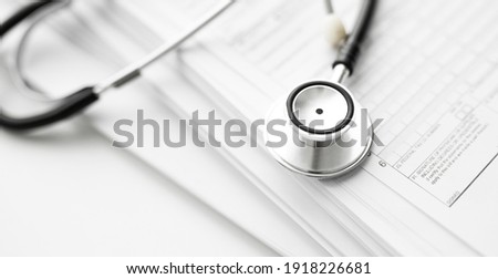 Books folder file with medical data and stethoscope isolated on white background Royalty-Free Stock Photo #1918226681