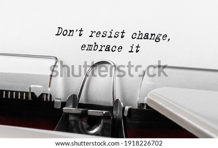 Text Do not resist change embrace it typed on retro typewriter