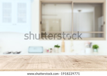 empty table board and defocused modern kitchen background. product display concept Royalty-Free Stock Photo #1918229771