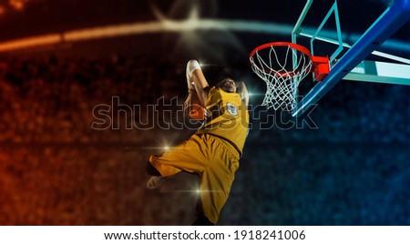 Basketball player players in action on arena background. Matte image