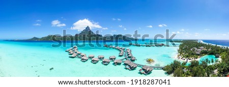 Aerial view of the Bora Bora atoll and luxury beach resort Royalty-Free Stock Photo #1918287041