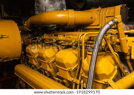 Diesel generator in the engine room of the ship, close-up.