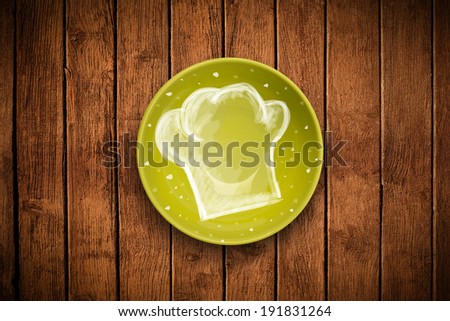Colorful plate with hand drawn white chef symbol on grungy background