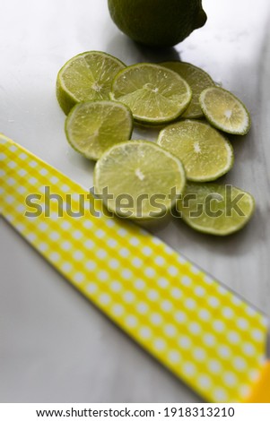 Photos of limes on a marble surface 